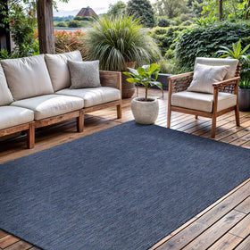 CAMILSON outdoor rug 5x7 navy solid, ideal for patios, easy to clean.