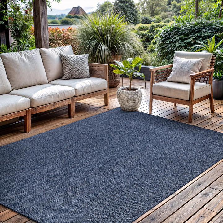 CAMILSON outdoor rug 5x7 navy solid, ideal for patios, easy to clean.