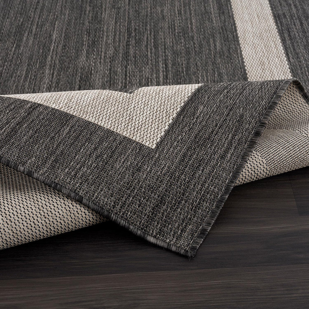 CAMILSON outdoor rug 8x10 border light gray adds bright accent and washes easily.