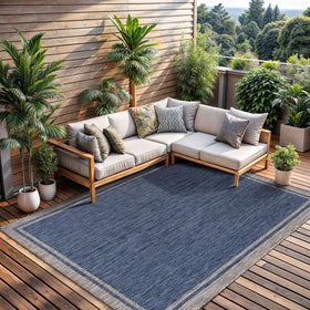 CAMILSON outdoor rug bordered navy 6x9 enhances patio style with durable construction.