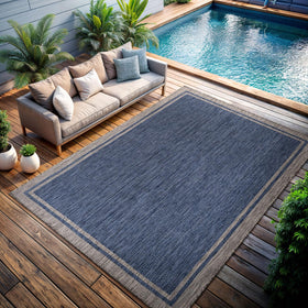 CAMILSON outdoor rug navy gray tone complements contemporary patios.