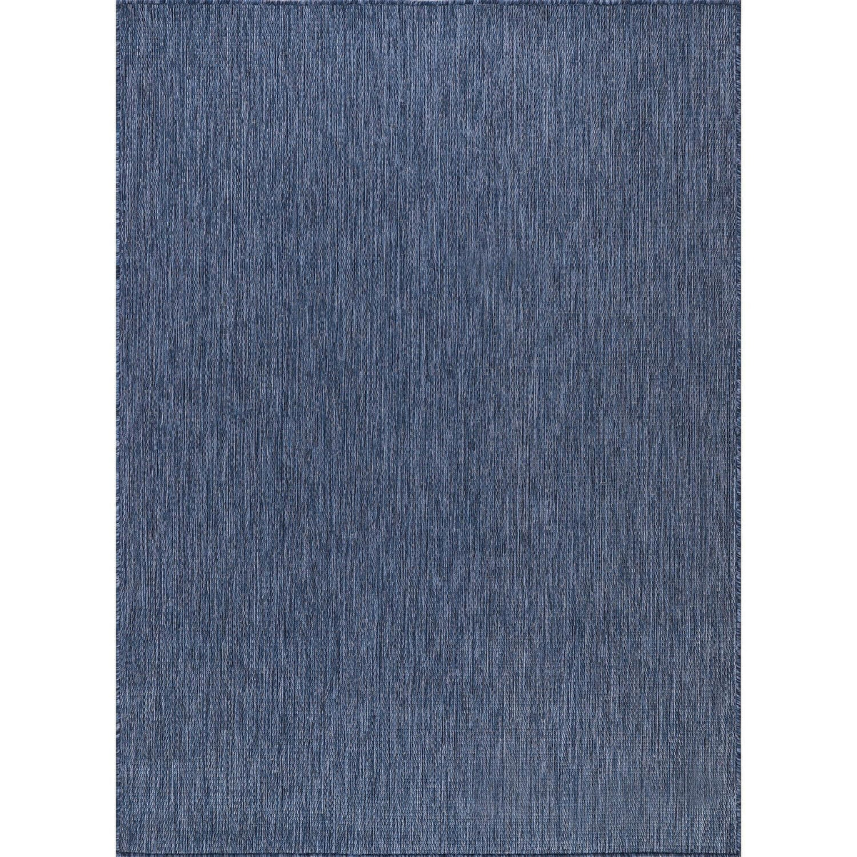 CAMILSON navy outdoor rug on balcony, UV-protected and stain-resistant for outdoor living.