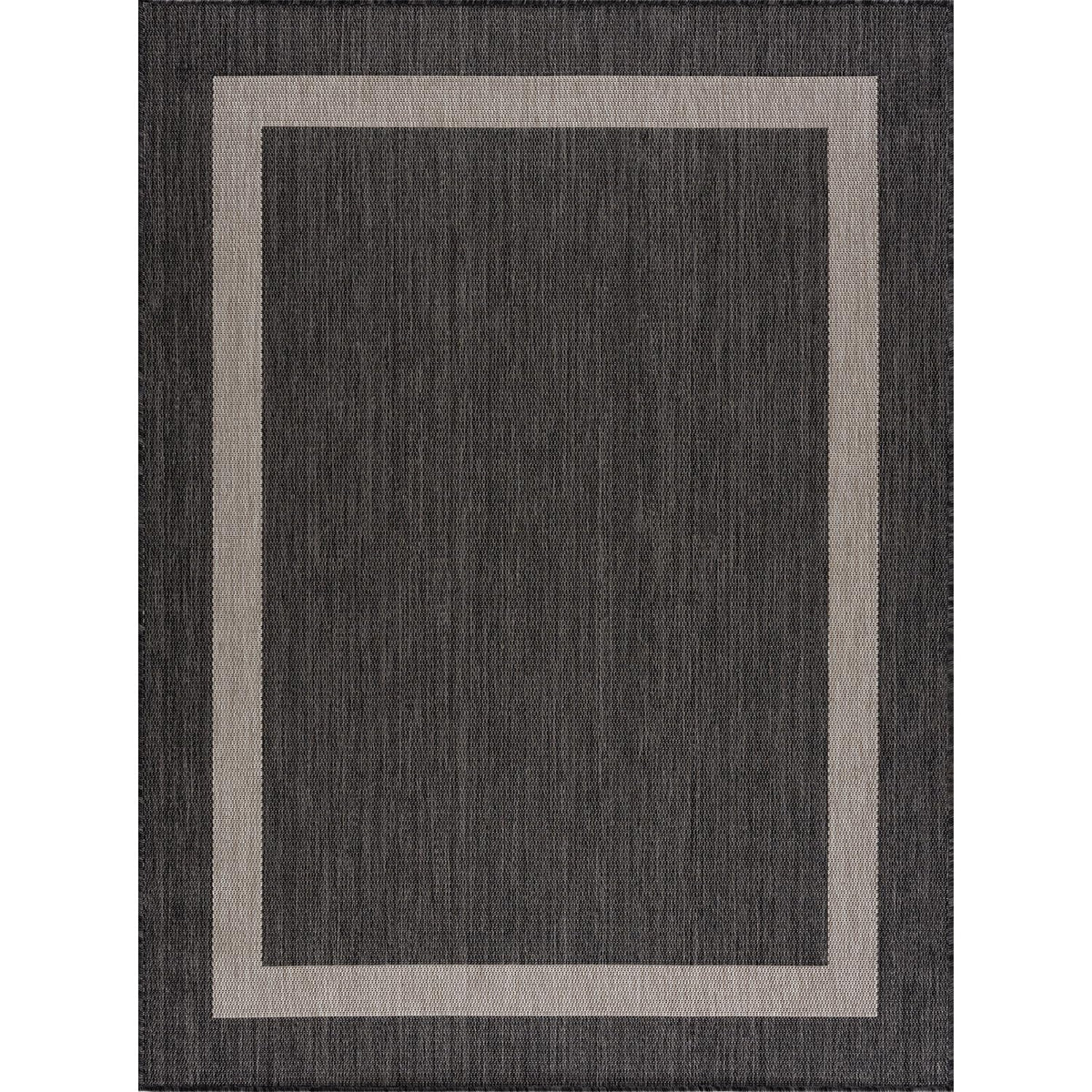 CAMILSON rug on patio in a modern outdoor setup