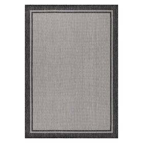 CAMILSON outdoor patio rug with grey border, designed for sun and weather resilience.