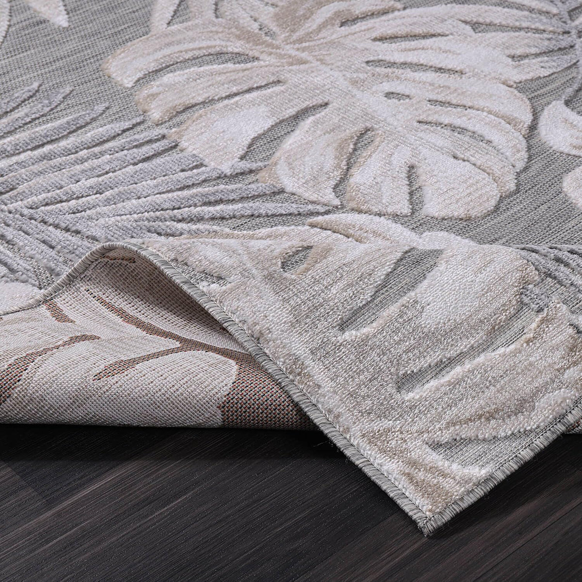 CAMILSON beige tropical rug enriches kitchen and living spaces with botanical flair.
