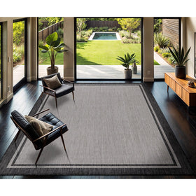 CAMILSON Turkish-made bordered grey rug emphasizing craftsmanship and durability.