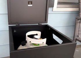 CAMPLUX propane tank cover table with side handles for mobility.