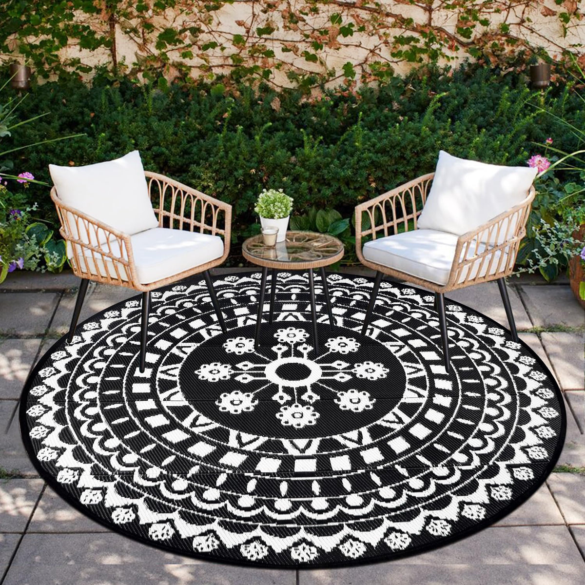 Capslpad 6ft round outdoor rug on patio provides cozy, durable comfort.