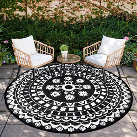Capslpad 6ft round outdoor rug on patio provides cozy, durable comfort.
