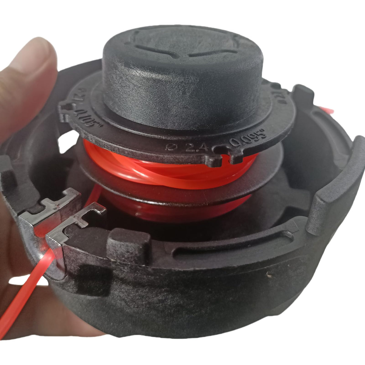 Carburionix 27-2 trimmer head performing ground-tap line adjustment