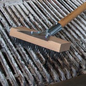 Carlisle heavy-duty tool in use on grill cleanup.