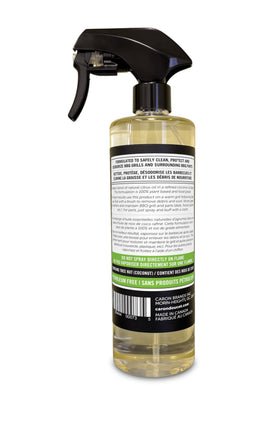 Caron & Doucet BBQ cleaner with wooden scraper demonstrates effective grill grate maintenance