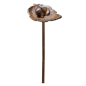 Carvers Olde Iron frog hose guide stake directs hoses around flower beds.