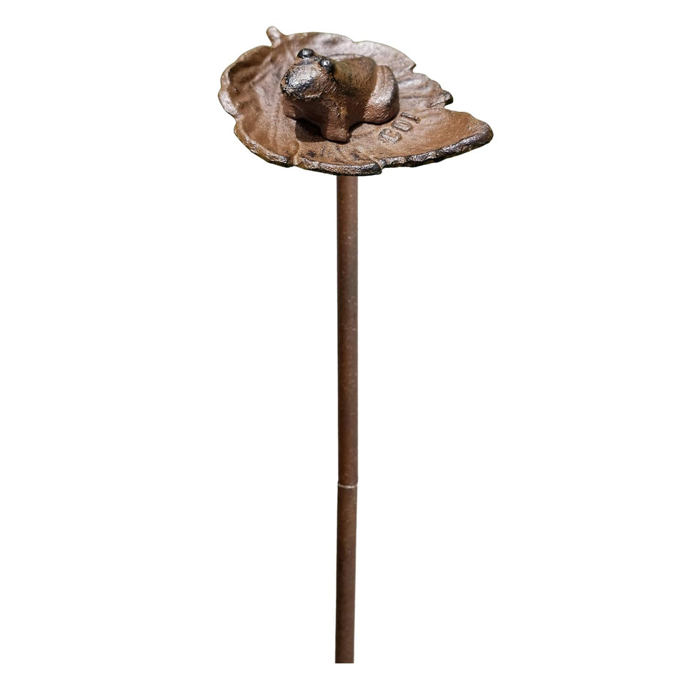 Carvers Olde Iron frog hose guide stake directs hoses around flower beds.