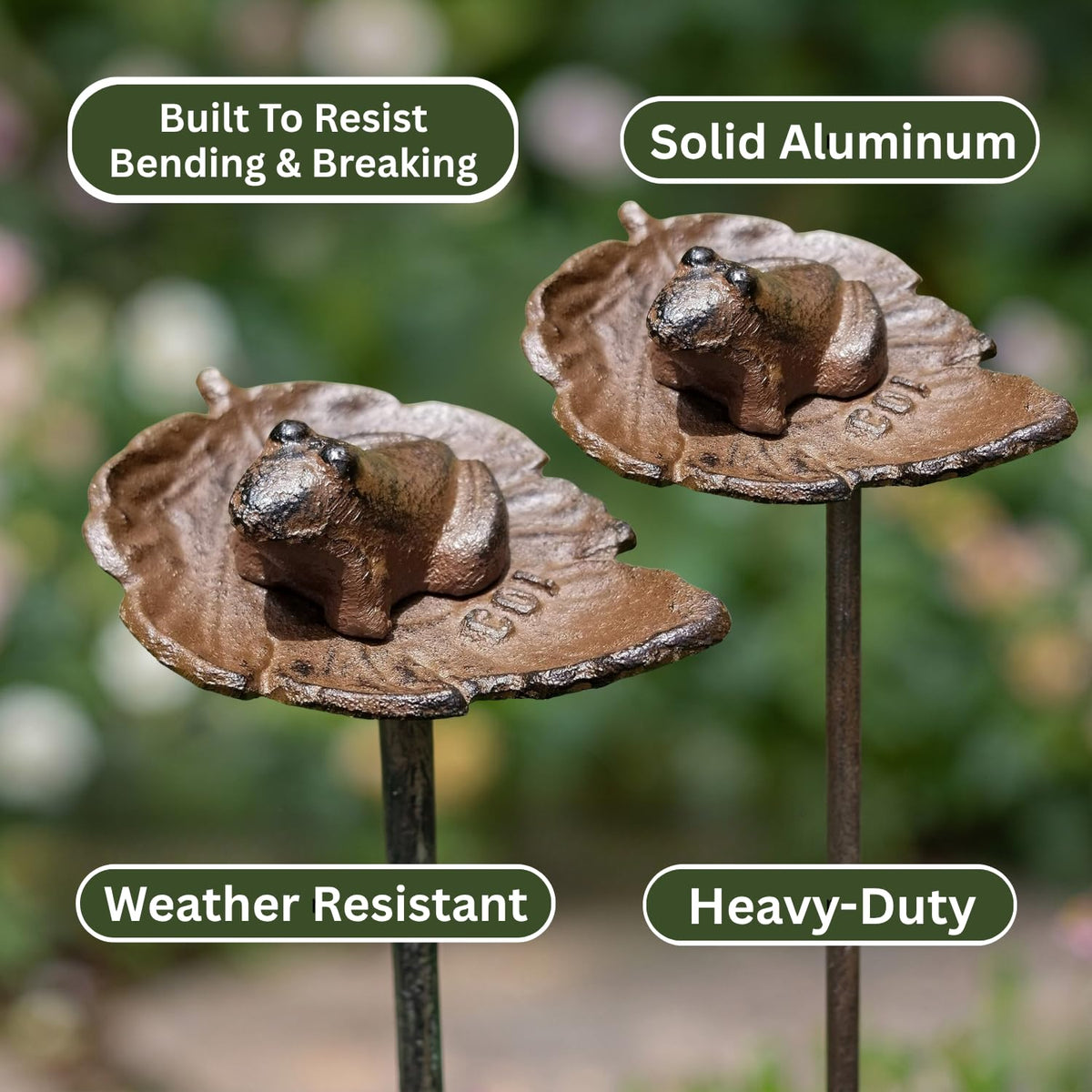 Carvers Olde Iron hose guide around flower beds protects plants.