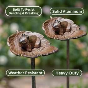 Carvers Olde Iron hose guide around flower beds protects plants.