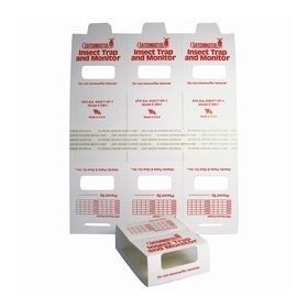 Catchmaster 15 Brown Recluse Glue Traps placed under cabinet to monitor infestation safely