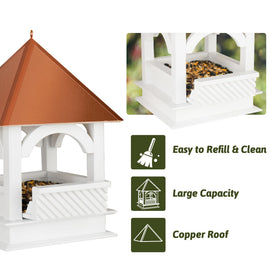 CEDAR ALPHA hanging feeder shown in a lush garden setting.