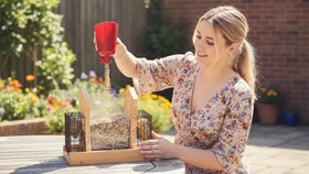 CEDAR ALPHA XL hopper feeder includes assembly parts and pre-drilled holes.