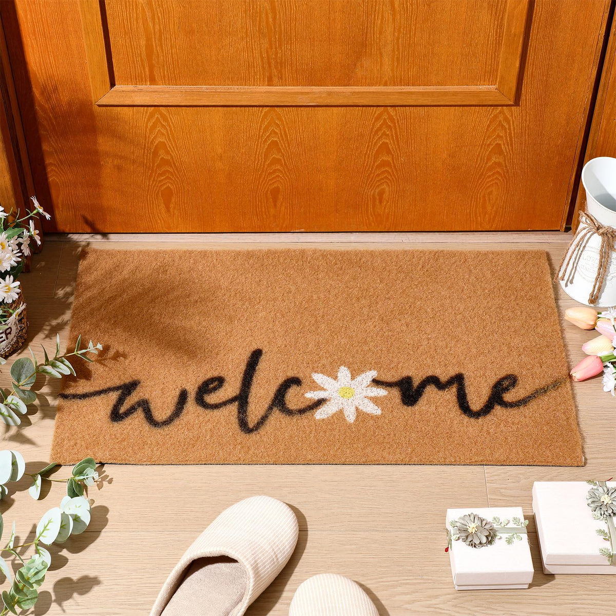 Ceenna daisy welcome doormat at front door with dirt-trapping design.