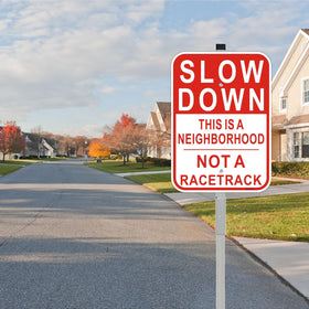 Cefrashi Slow Down sign with reflective aluminum finish improves visibility at dusk.