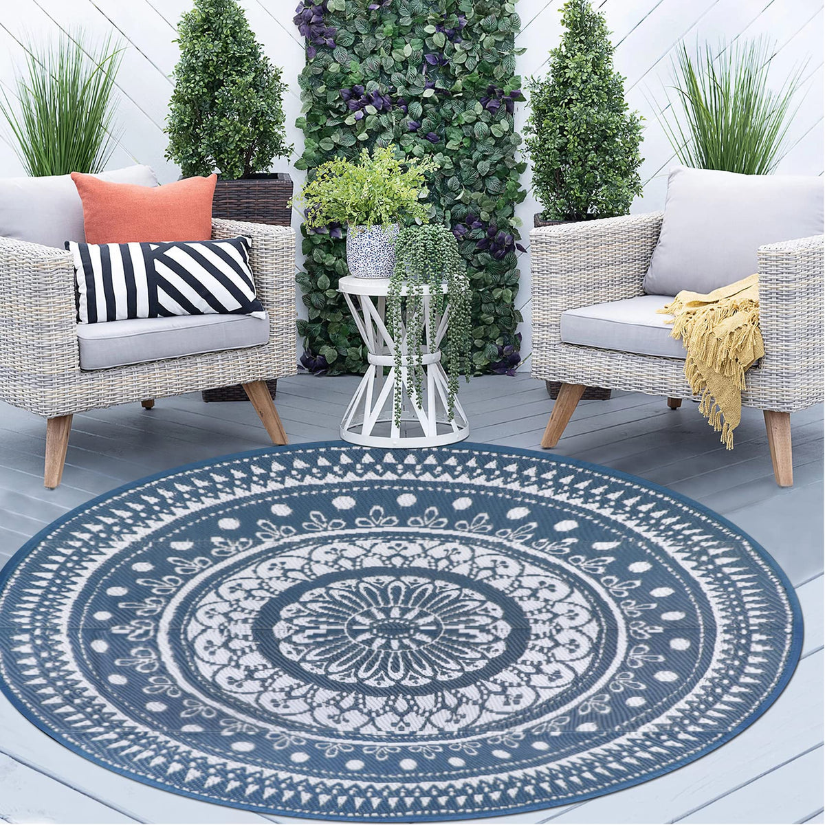 Cekene 5ft blue round outdoor rug on patio, waterproof for outdoor adventures.