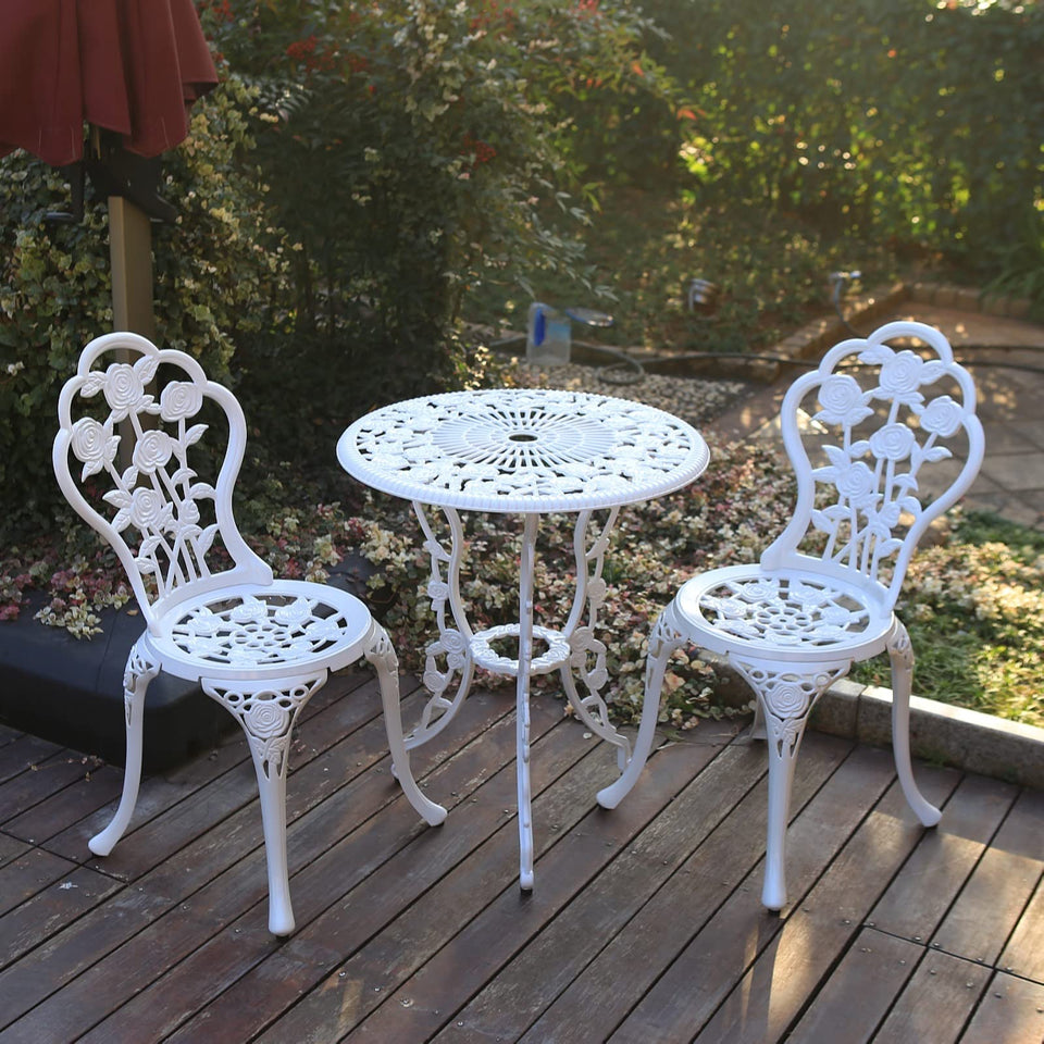 C/G patio bistro table with rose design for elegant outdoor dining.
