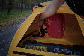 Waterproof cover shields Champion generator from rain while in use.