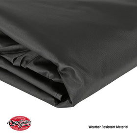 Char-Griller grill cover protects a backyard grill from rain and snow.