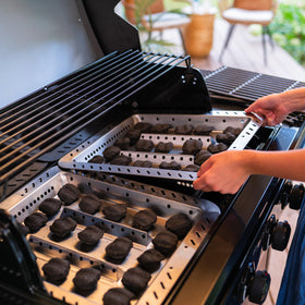 Ventilation design supports even heat and fast charcoal ignition on the tray