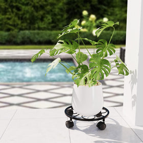 Chinpakden rolling plant stand with 360-degree wheels for easy repositioning.
