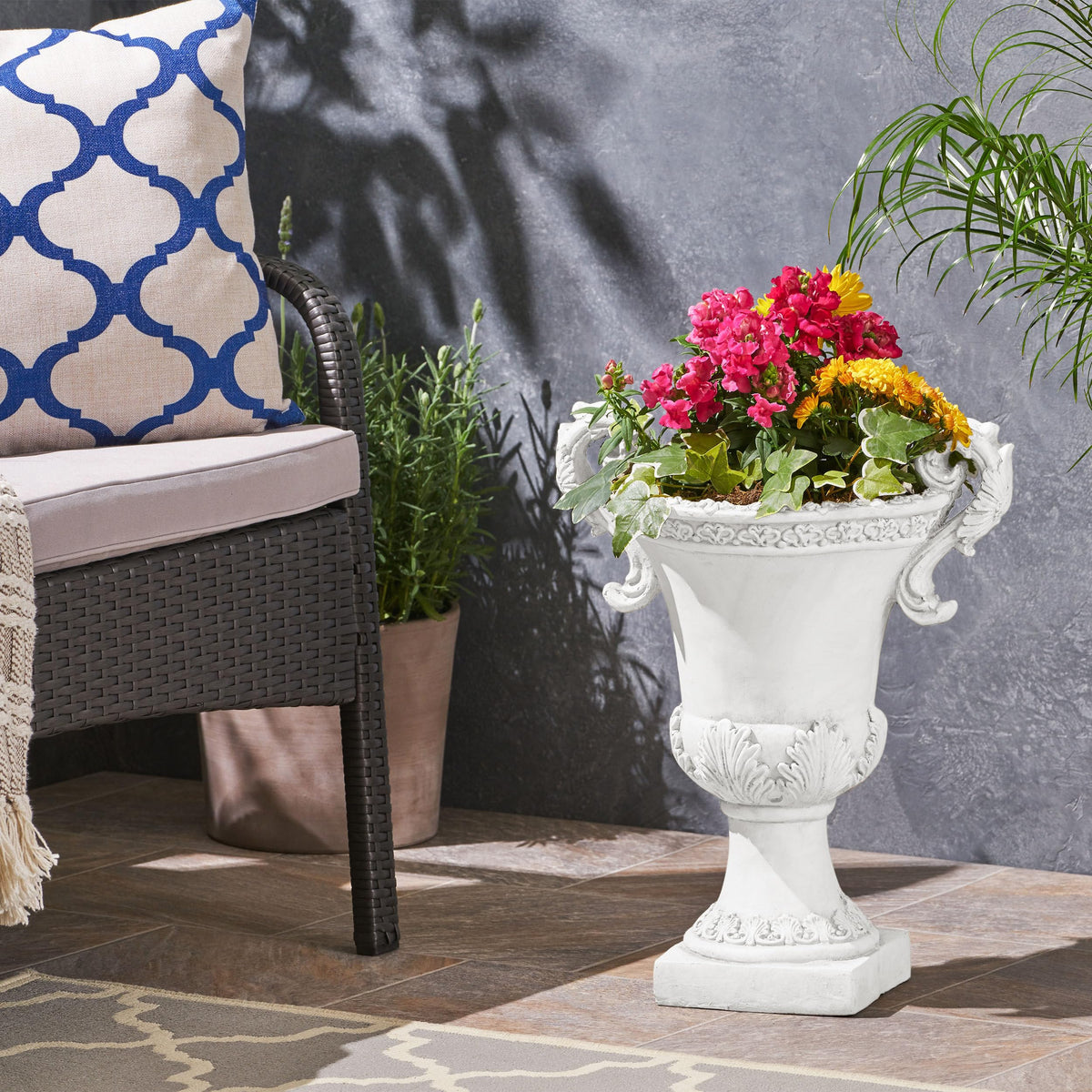 Jorine planter floral relief detail adds classic charm to outdoor space.