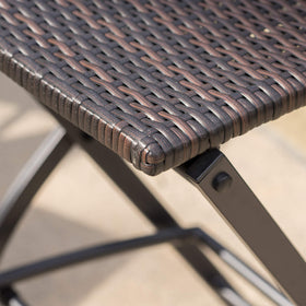 Durable iron frame wrapped in wicker provides outdoor resilience for patio dining
