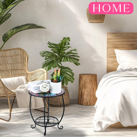 Cinnvoice butterfly-pattern metal table top adds charm and stability for plants or beverages.
