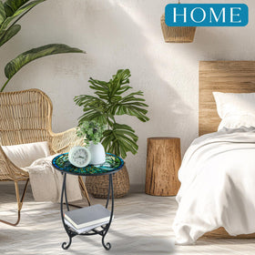 Cinnvoice hollow iron art table adds decorative charm for outdoor use.