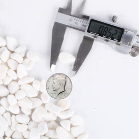 CJGQ White Pebbles used as vase fill for elegant arrangements.