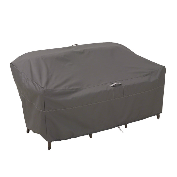 Classic Accessories Ravenna cover with windLock system shields the 76-inch loveseat from gusts.