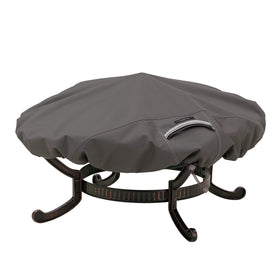 Classic Accessories Ravenna fire pit cover protects a 60-inch round pit from weather