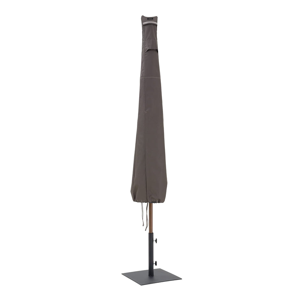Classic Accessories Ravenna 11ft umbrella cover protecting a patio umbrella from weather