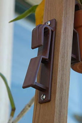 Terracotta pot display using Clever Gardener brown hangers on stone or wood