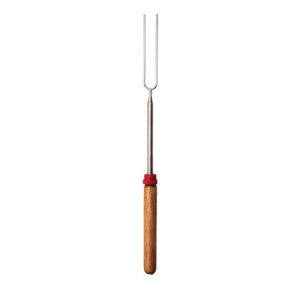Coghlan's telescoping roasting fork with wooden handle extended for campfire cooking
