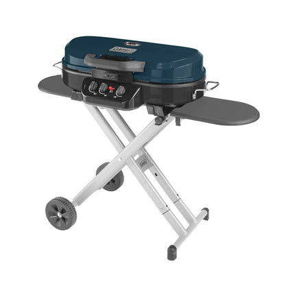 Coleman RoadTrip 285 side view shows compact stand and burners for easy outdoor cooking.