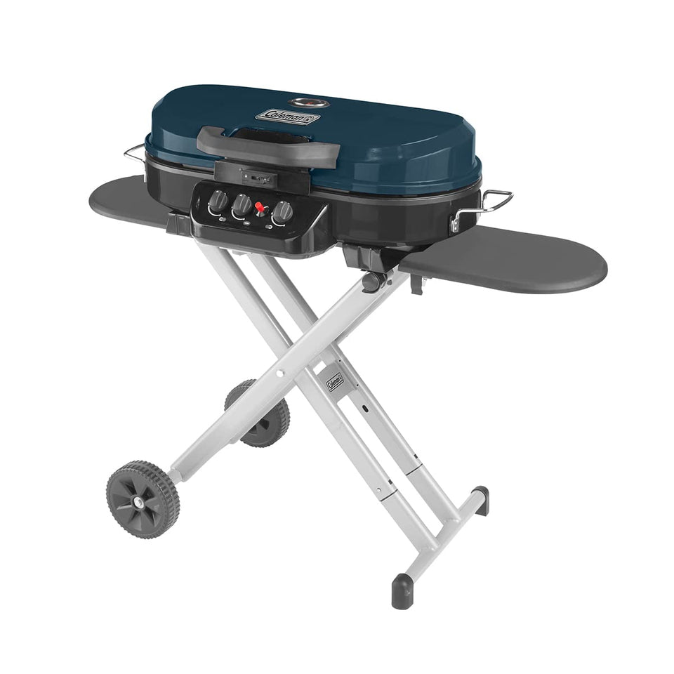 Coleman RoadTrip 285 side view shows compact stand and burners for easy outdoor cooking.