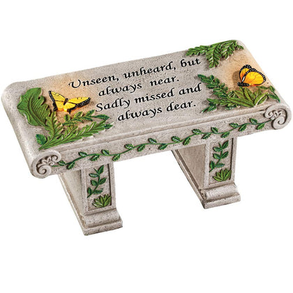 Collections Etc solar powered outdoor memorial bench glowing at night