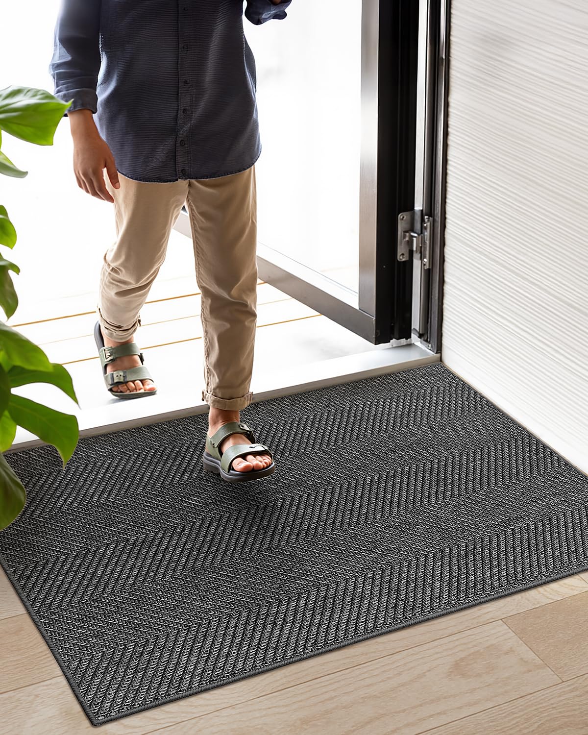 Color&Geometry dark grey doormat complements modern interiors while hiding dirt.