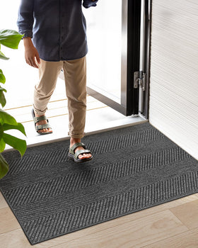 Color&Geometry dark grey doormat complements modern interiors while hiding dirt.
