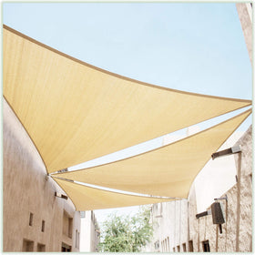 ColourTree TAPT20 beige triangle sun sail over a shaded patio area