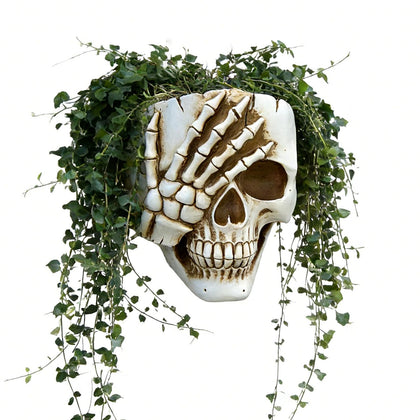 COMODID skull planter front view for gothic indoor decor with small plants.