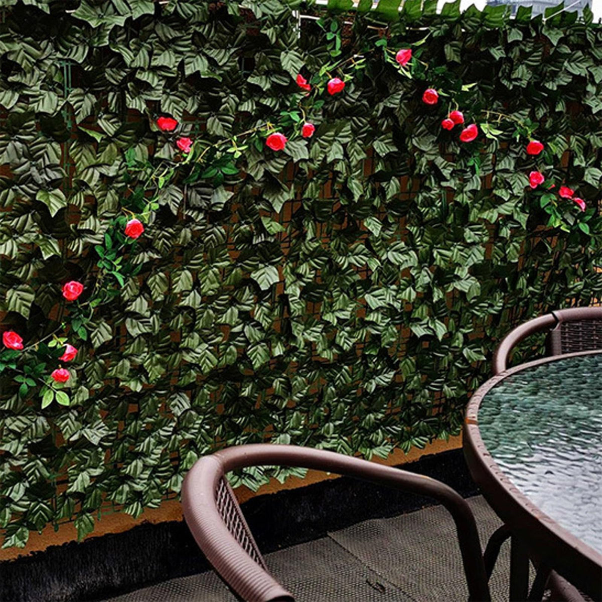 Comtelek garden decor with faux ivy panels as a hedge backdrop.