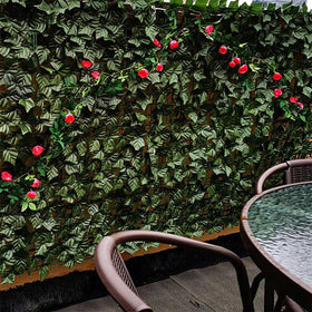 Comtelek garden decor with faux ivy panels as a hedge backdrop.